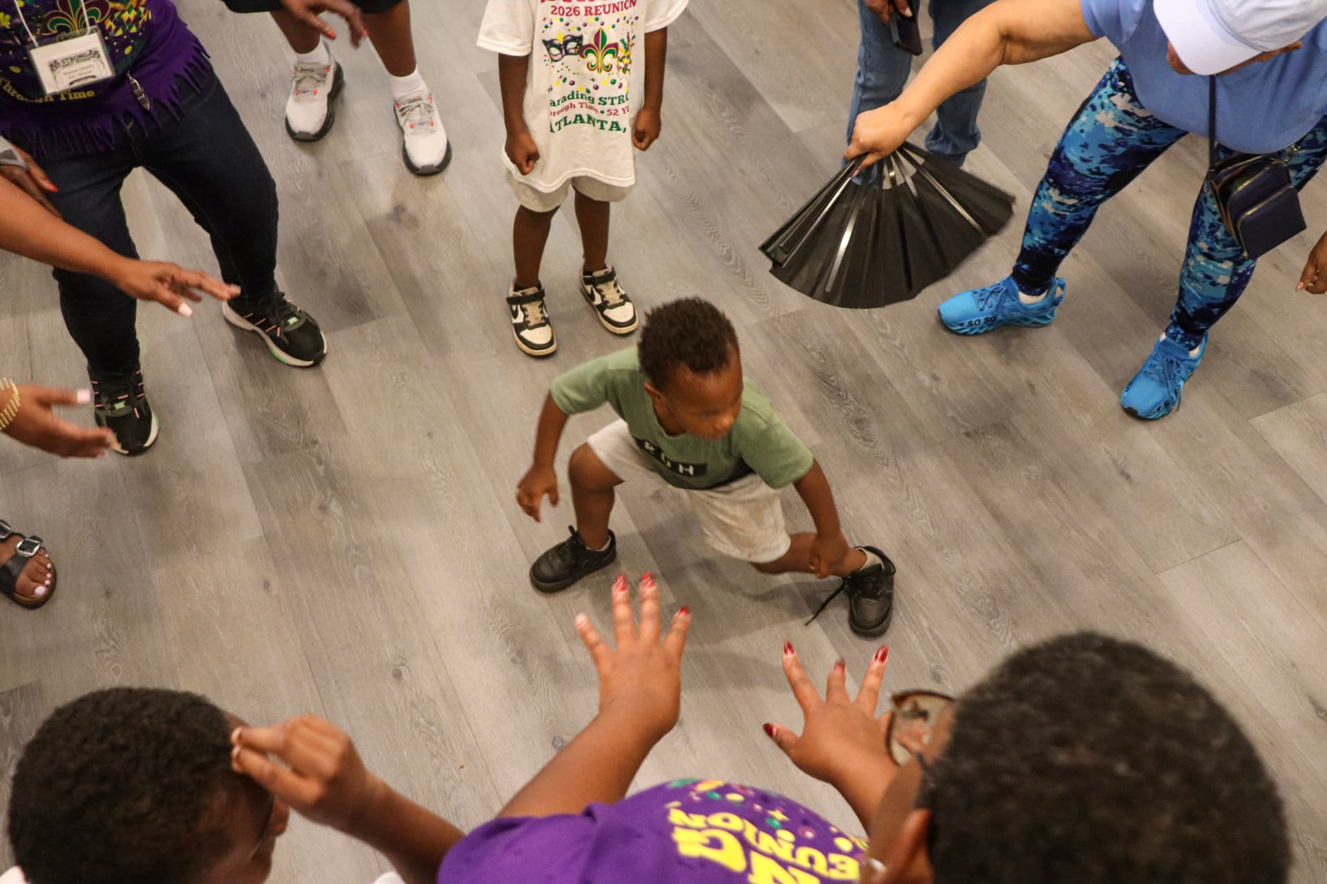 Little one dancing in the middle of the circle